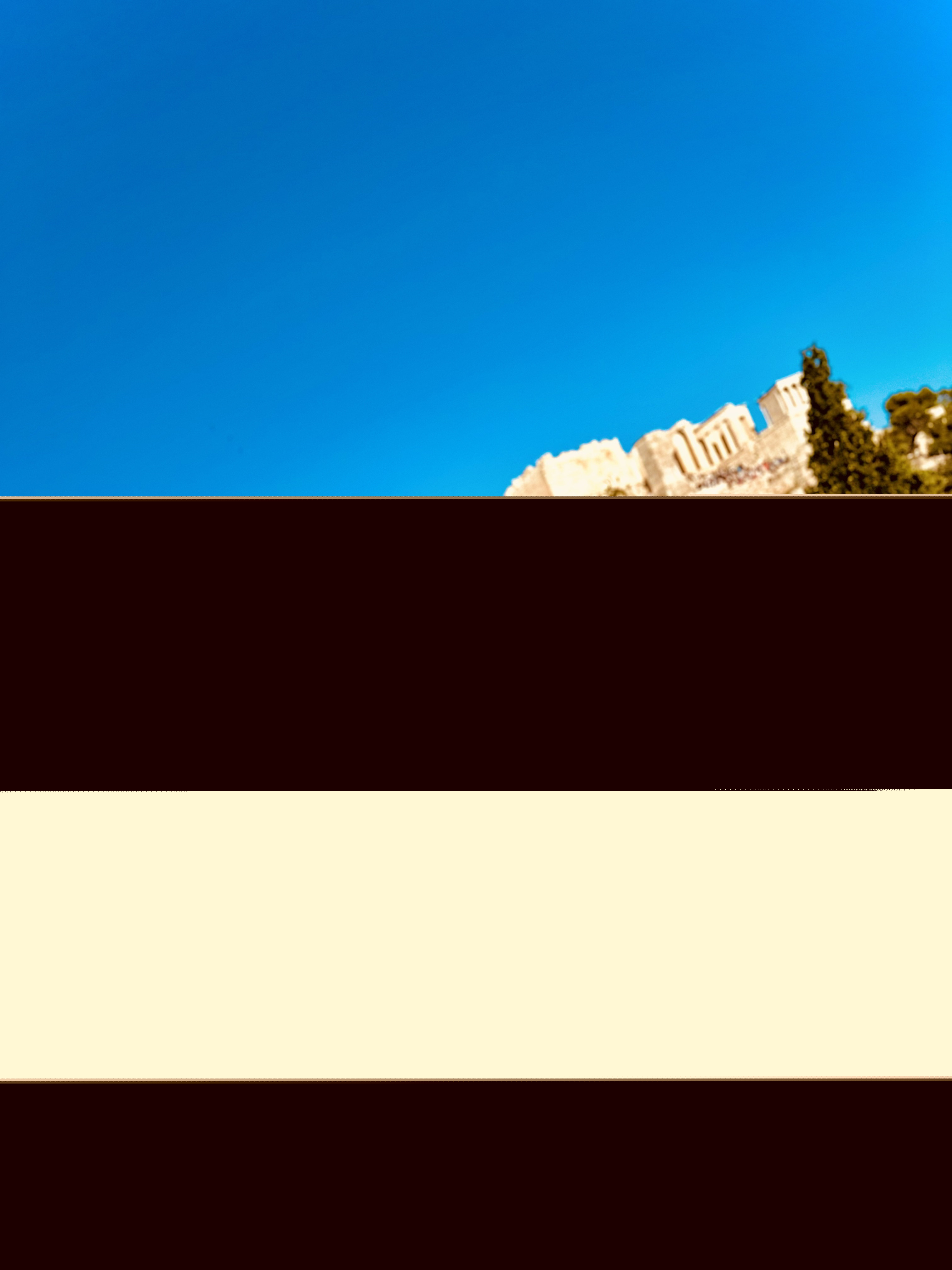 Aryan Rohira standing against the historic Acropolis in Athens